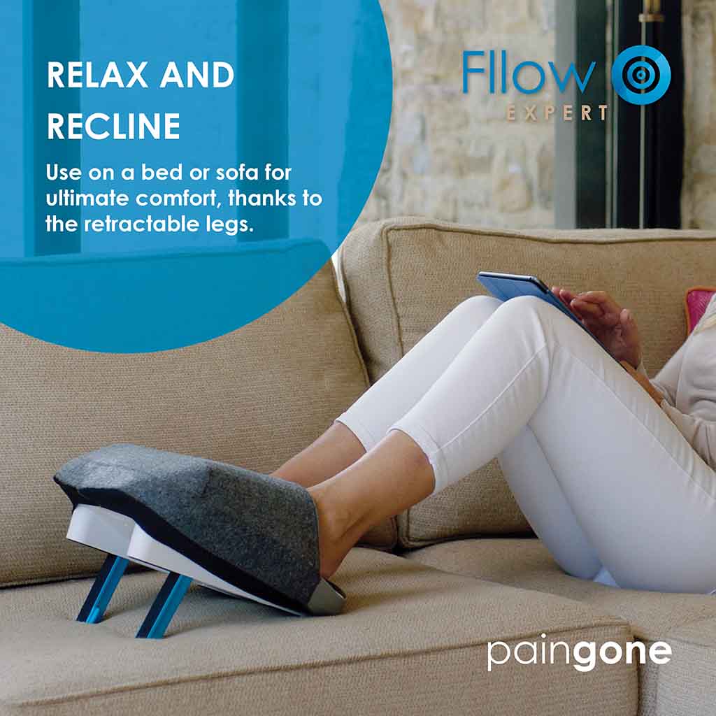 Image of a person using Paingone Fllow with the foot cover on the couch, with the message "Use on a bed or sofa for ultimate comfort, thanks to the retractable legs."