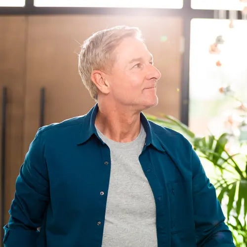 Man standing comfortably after using PainGone Aegis for lower back pain