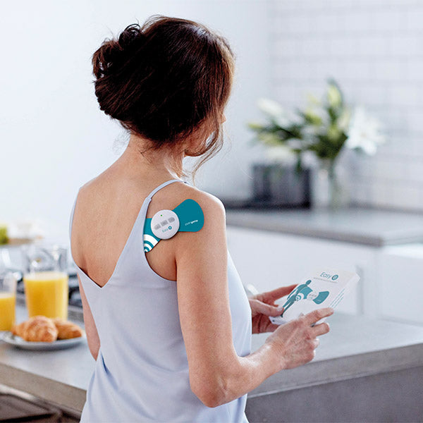 Paingone Easy being used by a woman on her shoulder