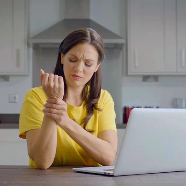 Image of a woman locating wrist pain