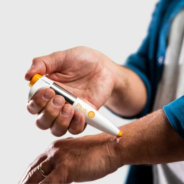 PainGone Plus pen applied to the hand